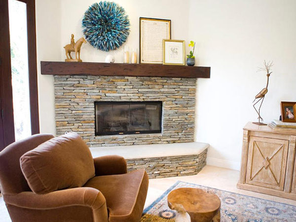 stone fireplace living room cozy armchair