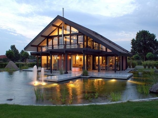 stunning house design glass walls garden pond