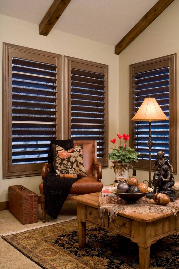 Family room plantation window shutters rustic table