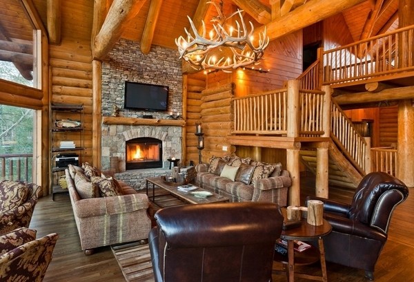 Rustic living room stone fireplace round-antler-chandelier