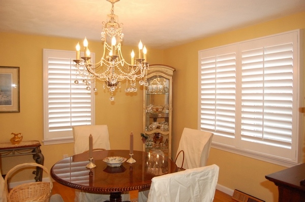 White wood plantation shutters in dining room design