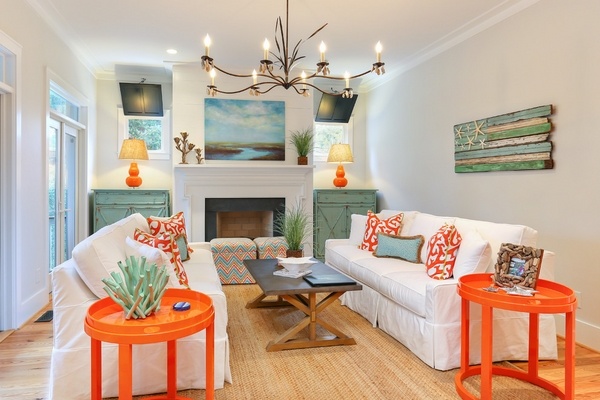 decorating rooms beach style living room white furniture orange side tables