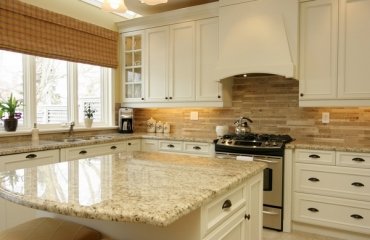 santa-cecilia-gold-granite-countertops-modern-kitchen-white-cabinets