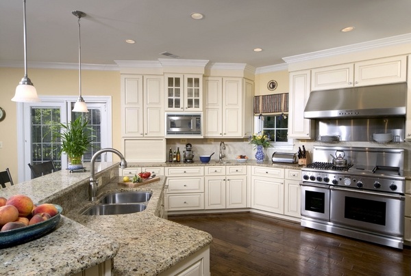 santa-cecilia-light-granite-countertops white kitchen cabinets stainless steel appliances