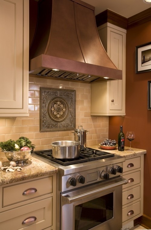 tudor-kitchen-design-subway-tile-pattern-medallion behind the stove