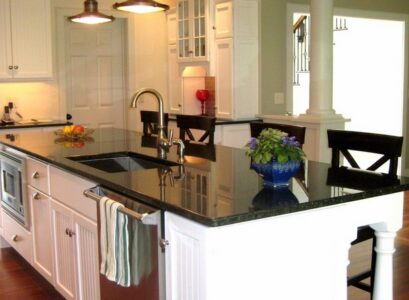 uba-tuba-granite-with-white-backsplash-and-kitchen-cabinets-pendant-lighting-fixtures