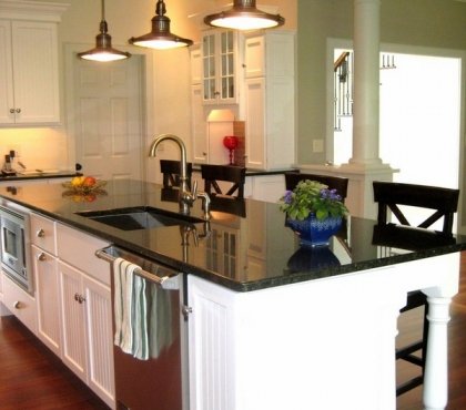 uba-tuba-granite-with-white-backsplash-and-kitchen-cabinets-pendant-lighting-fixtures