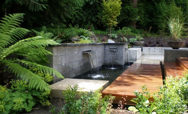 features for backyard garden stone wall wooden deck green environment
