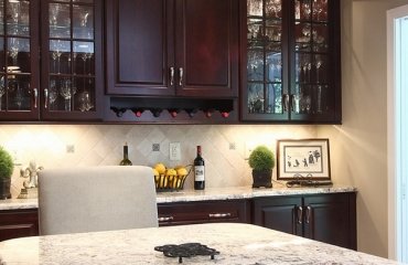 Bianco-Romano-granite-countertops-dark-kitchen-cabinets-contemporary-kitchen-ideas