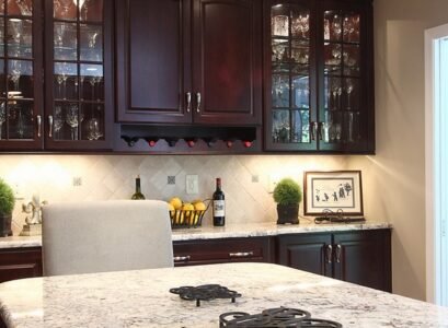 Bianco-Romano-granite-countertops-dark-kitchen-cabinets-contemporary-kitchen-ideas