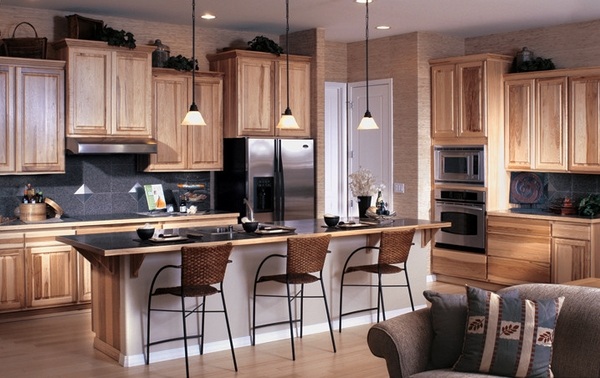 Contemporary kitchen hickory cabinets different height pendant lights