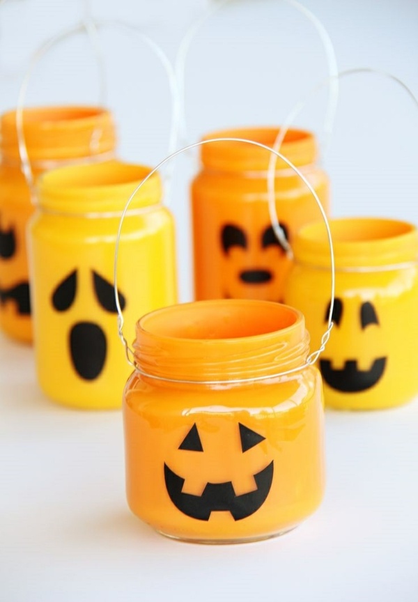 DIY-halloween-decoration-ideas-glass-jars-candle-holder-orange-with-face
