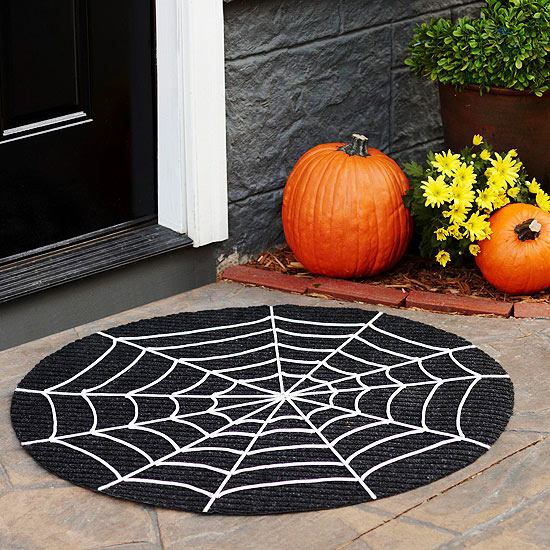 Halloween decorating ideas doormat tape spider web