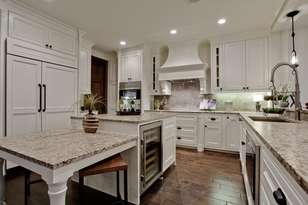 Mediterranean kitchen countertops white cabinets wood flooring