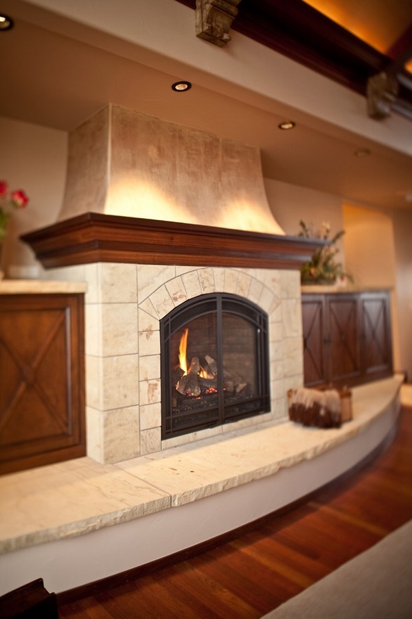 Neutral color stone fireplace hearth and surround wood mantel 