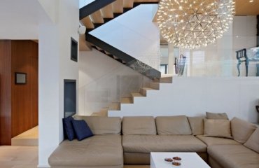 interior-design-ideas-leather-sectional-sofa-contemporary-chandelier