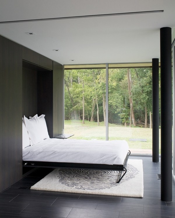 minimalist bedroom design black furniture white area rug murphy bed