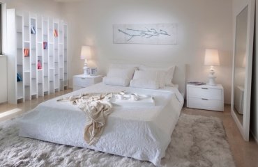 modern-white-master-bedroom-designs-wall-shelves-large-mirror