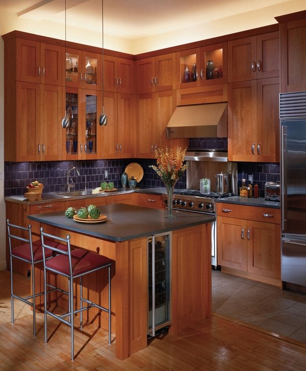 shaker style cabinets cherry wood tile backsplash wood flooring