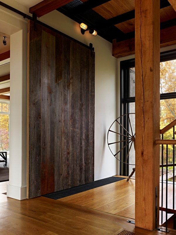 sliding dark wood house entry design