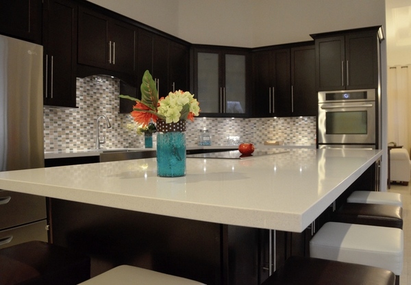 white quartz countertop dark kitchen cabinets modern contrast