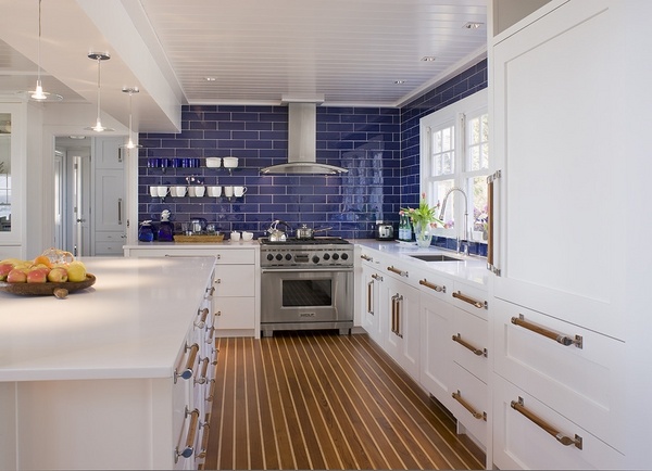 white shaker cabinets blue tile backspash wall hardwood flooring