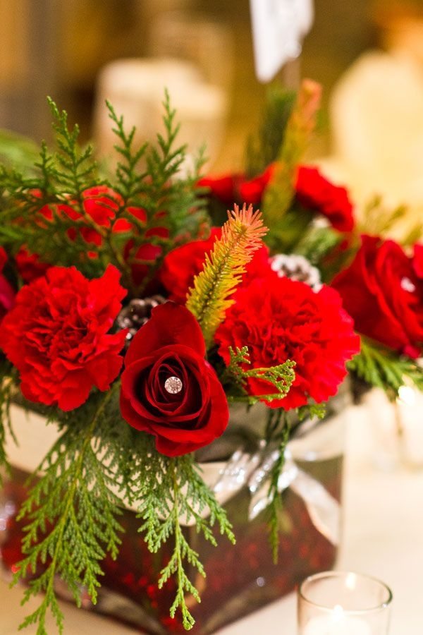 centerpiece fresh flowers red roses carnations evergreens