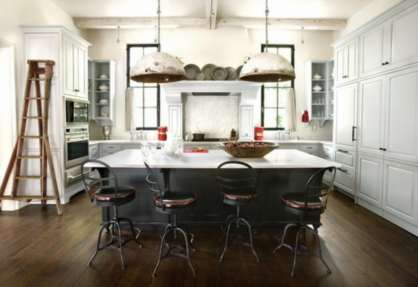 Loft apartment kitchen large pendant lights white cabinets