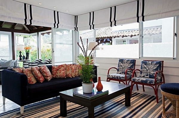 Lounge area design with striped Roman blinds