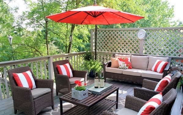 Rattan outdoor patio furniture cushions with red umbrella