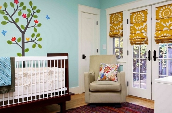 Roman blinds with floral pattern nursery room