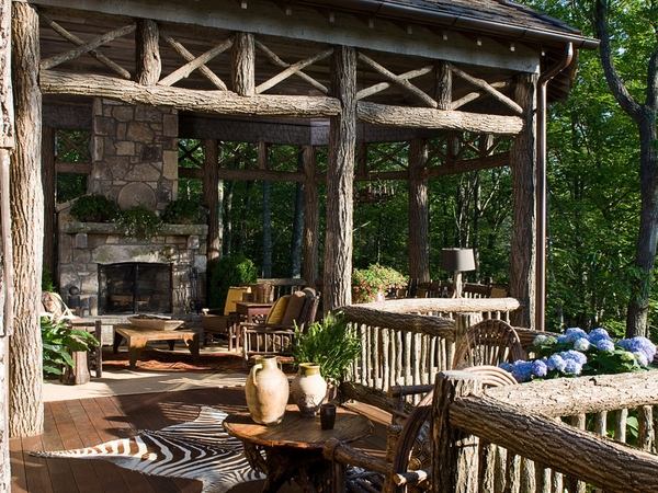 Rustic-outdoor furniture patio design wooden deck natural stone fireplace clay pots