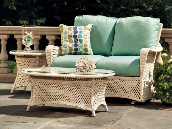 White wicker loveseat green cushions outdoor furniture coffee table side table