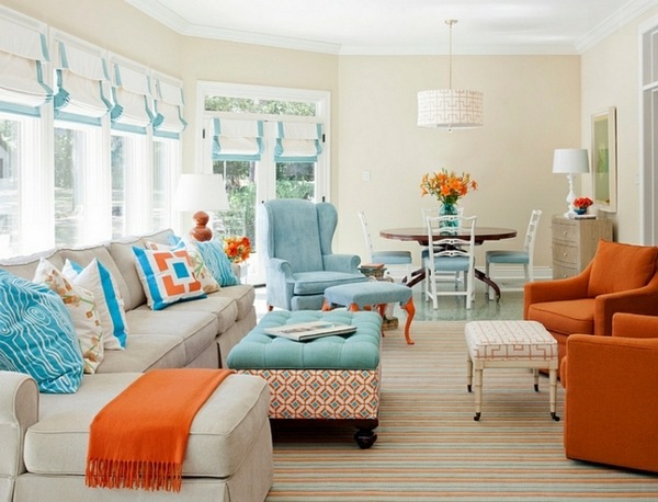 living room window treatment roman shades colorful pillows symmetrical figures