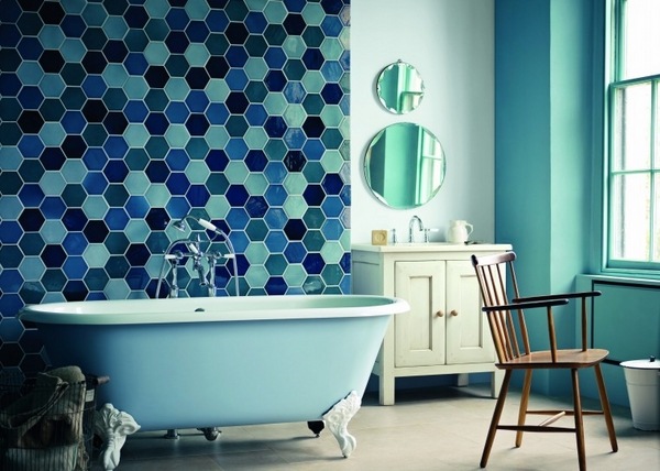 small bathroom blue clawfoot bathtub hexagon tiles white vanity cabinet