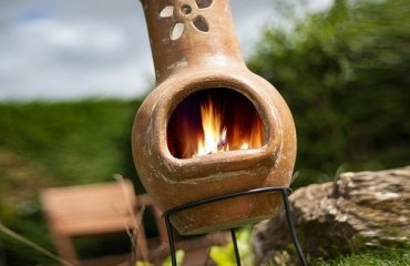 small-clay-chiminea-flower-decoration-patio-fireplace-ideas