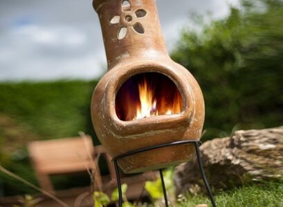 small-clay-chiminea-flower-decoration-patio-fireplace-ideas