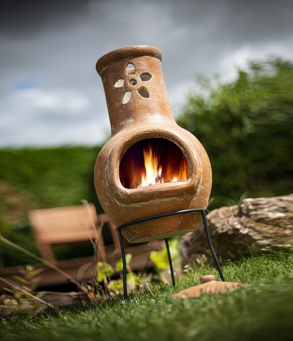 small clay chiminea flower decoration patio fireplace ideas