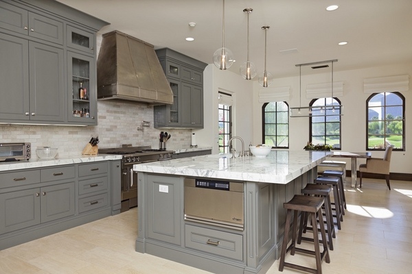 gray-kitchen-cabinets-travertine-countertops-kitchen-island-with-seating