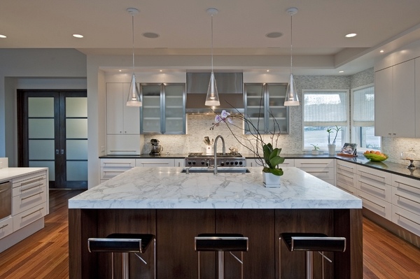 modern-kitchen-white-cabinets kitchen island-travertine-countertop