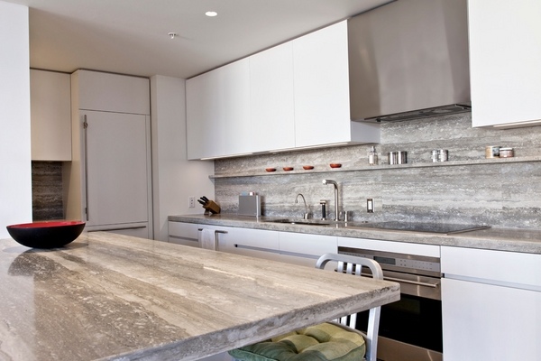 travertine-countertops-backsplash-white-kitchen-cabinets