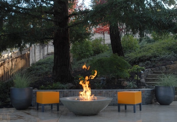 patio design round fire orange chairs
