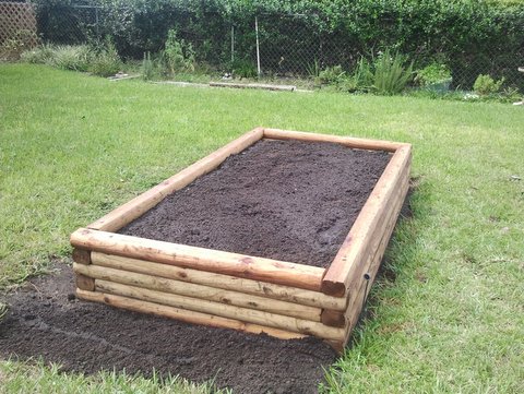 how to build a raised garden bed construction tips