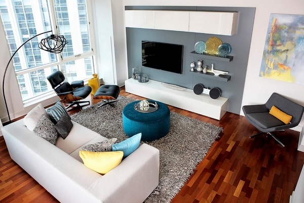 modern living room white sofa blue pouf ottoman