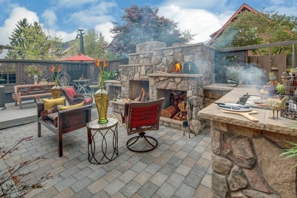 outdoor-kitchen-ideas-stone-fireplace-with-pizza-oven-dining-furniture-set