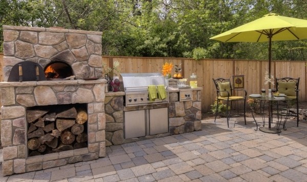 patio deck stone fireplace grill area dining table