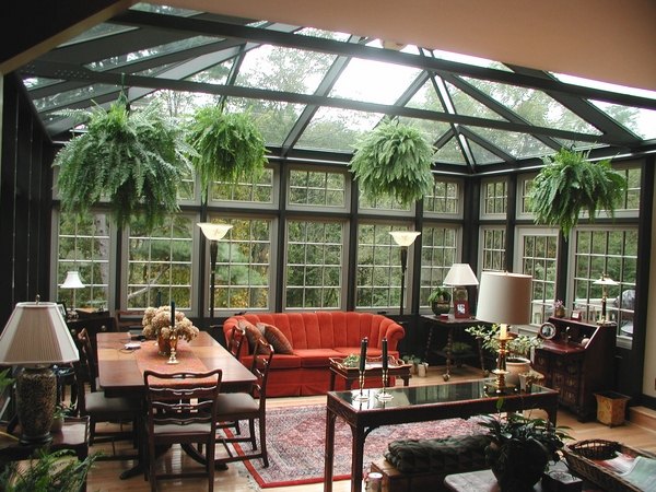 sunroom interior design red sofa glass walls and roof 