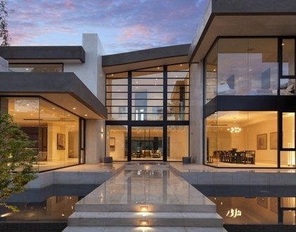 Modern-house-design-exterior-glass-front-door-koi-pond