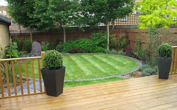 adorable small garden ideas wooden deck round lawn shrubs