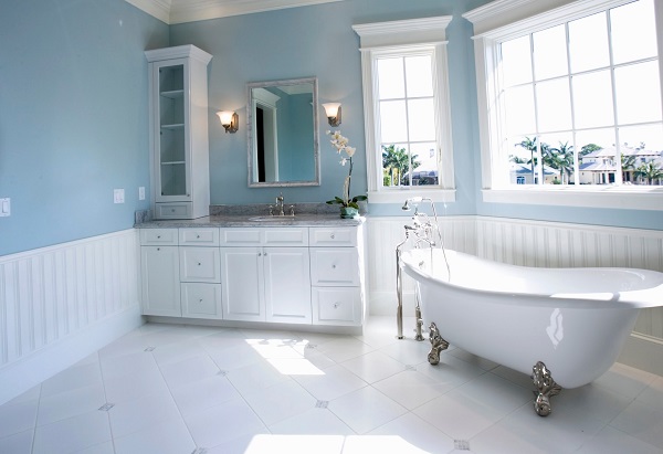 bathroom design white panels blue walls freestanding tub